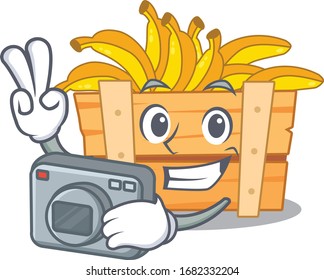 banana fruit box mascot design as a professional photographer with a camera
