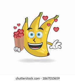 Banana mascot character holding a love icon. vector illustration