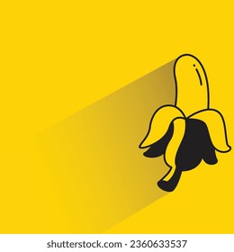 Banane mit Schatten auf gelbem Hintergrund