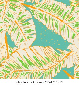 Banana Tropical leaves floral print exotic seamless pattern. The texture of the fabric leaves of banana and palm trees. Exotic Hawaiian print for swimsuits.