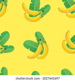 Bananas and banana leaves seamless pattern. Two bananas and two green leaves on a yellow background. Vector pattern.