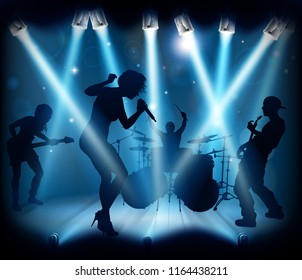 A band playing music at a live concert  on a stage with spotlights in silhouette