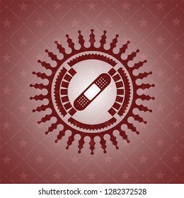 bandage plaster icon inside badge with red background