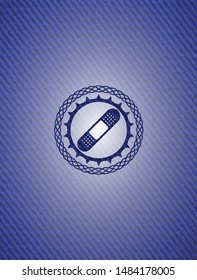 bandage plaster icon inside badge with denim background