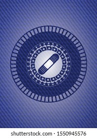 bandage plaster icon inside badge with denim background