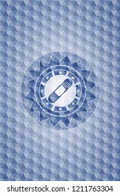 bandage plaster icon inside blue badge with geometric pattern.