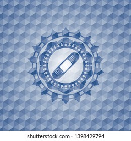 bandage plaster icon inside blue emblem or badge with geometric pattern background.