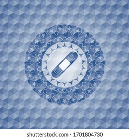 bandage plaster icon inside blue emblem with geometric pattern.