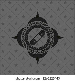 bandage plaster icon inside dark badge or emblem