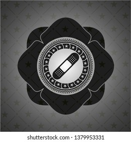 bandage plaster icon inside dark badge or emblem