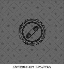 bandage plaster icon inside dark badge or emblem