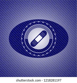 bandage plaster icon inside emblem with jean background