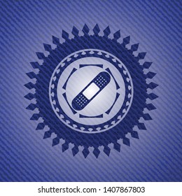bandage plaster icon inside emblem with denim texture