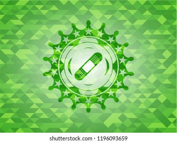 bandage plaster icon inside green mosaic emblem