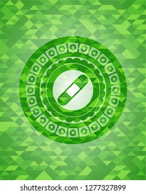 bandage plaster icon inside green emblem. Mosaic background