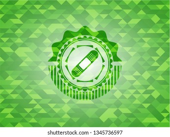 bandage plaster icon inside green emblem with mosaic ecological style background