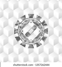 bandage plaster icon inside grey emblem with geometric cube white background