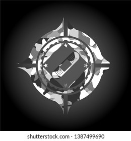 bandage plaster icon inside grey camo emblem