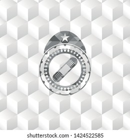 bandage plaster icon inside grey badge with geometric cube white background