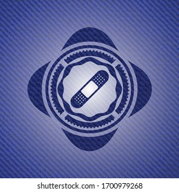 bandage plaster icon inside jean or denim emblem or badge background