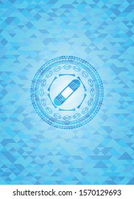 bandage plaster icon inside light blue emblem. Mosaic background