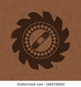 icono de escayola de vendas dentro de emblema de madera realista