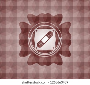 bandage plaster icon inside red seamless emblem with geometric pattern.
