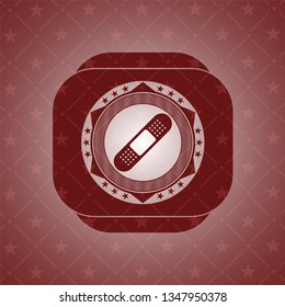bandage plaster icon inside red icon or emblem