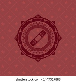 bandage plaster icon inside red icon or emblem