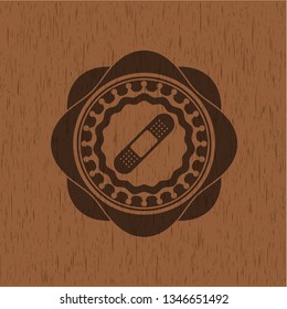 bandage plaster icon inside retro wood emblem