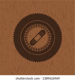 bandage plaster icon inside retro wood emblem