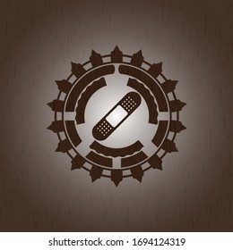 bandage plaster icon inside retro style wooden emblem