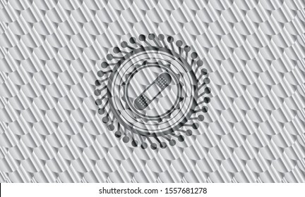 bandage plaster icon inside silver shiny emblem. Scales pattern. Vector Illustration. Detailed.