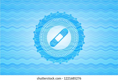 bandage plaster icon inside sky blue water wave style badge.