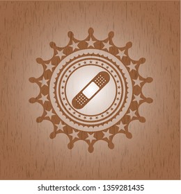 bandage plaster icon inside vintage wooden emblem