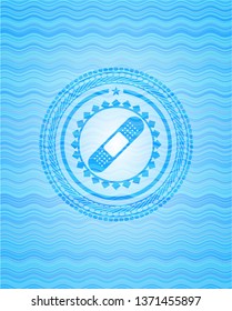 bandage plaster icon inside water representation badge.