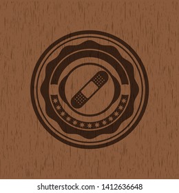 bandage plaster icon inside wooden emblem. Retro