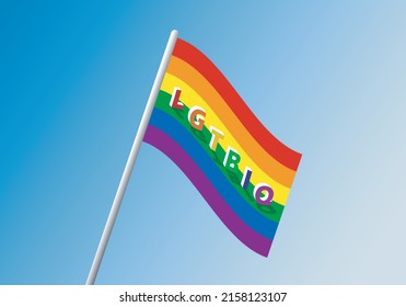 Bandera LGTBI ondeando en el cielo azul