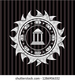 bank icon inside silvery emblem or badge