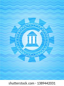 bank icon inside sky blue water emblem.