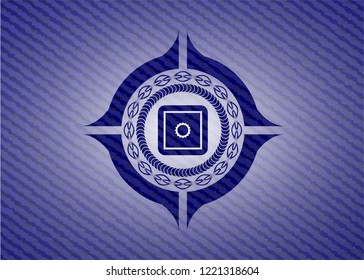 bank safe icon inside badge with denim texture