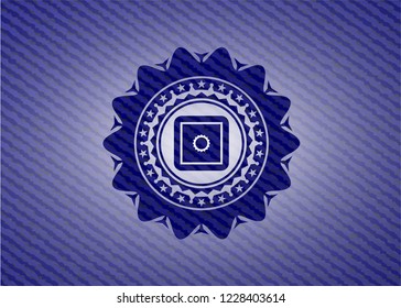 bank safe icon inside badge with denim background