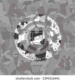 bank safe icon inside grey camouflage emblem