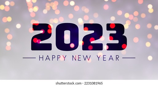 Banner with 2023 happy new year sign on sweaty grass on colorful bokeh lights background.
