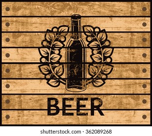 banner with the logo of a beer bottle on the background of the wooden box