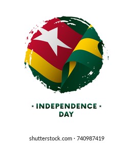 Banner or poster of Togo Independence Day celebration. Waving flag of Togo, brush stroke background. Vector illustration.