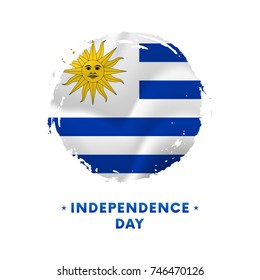 Banner or poster of Uruguay Independence Day celebration. Waving flag of Uruguay, brush stroke background. Vector illustration.