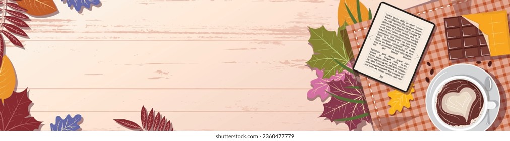 Banner template with autumn leaves, blanket, coffee, chocolate and ebook on wooden table. View from top