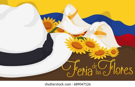 Banner with traditional arriero hat decorated with calla lilies and yellow daisies over a waving Colombian flag for Flowers Festival (written in Spanish).