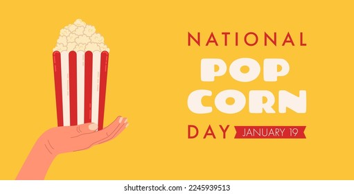 Banner for web design and graphic design for National Popcorn Day on January 19th with hand holding box of red and white striped popcorn.